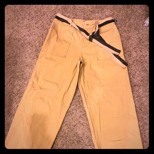 Khaki wide leg pants with fabric belt.